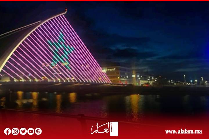 مشهد استثنائي.. جسر "صامويل بيكيت" الشهير في إيرلندا يكتسي ألوان العلم المغربي احتفاءً بعيد العرش المجيد مشهد استثنائي.. جسر "صامويل بيكيت" الشهير في إيرلندا يكتسي ألوان العلم المغربي احتفاءً بعيد العرش المجيد